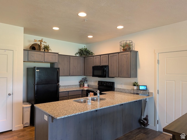 796 E 500 S, American Fork, UT 84003 - kitchen featuring black appliances, a peninsula, dark wood-style flooring, light stone counters, and recessed lighting