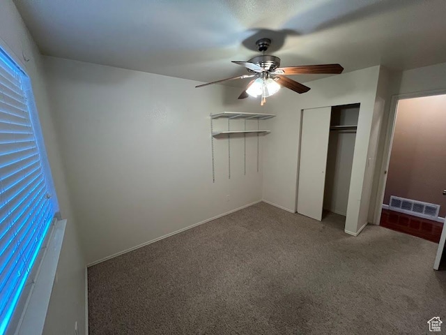 1809 W 7600 S Unit E303, West Jordan, UT 84084 - unfurnished bedroom with carpet floors, a closet, and a ceiling fan