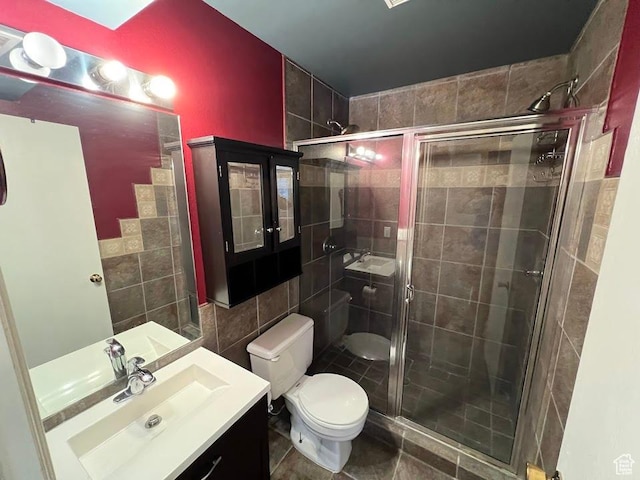 1809 W 7600 S Unit E303, West Jordan, UT 84084 - bathroom featuring tile walls, vanity, and a stall shower