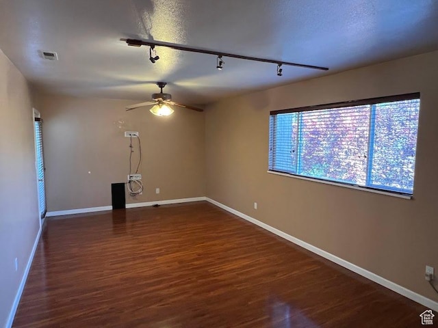 1809 W 7600 S Unit E303, West Jordan, UT 84084 - unfurnished room featuring rail lighting, ceiling fan, and dark wood-style flooring