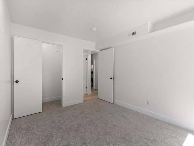 5561 S Willow Ln Unit C, Murray, UT 84107 - unfurnished bedroom with carpet and a closet
