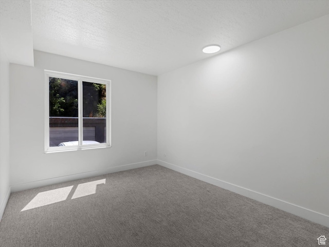 5561 S Willow Ln Unit C, Murray, UT 84107 - unfurnished room with carpet floors and a textured ceiling