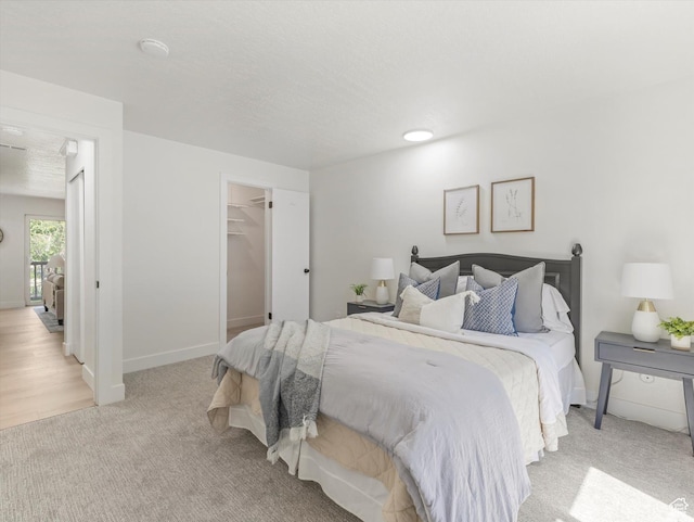 5561 S Willow Ln Unit C, Murray, UT 84107 - bedroom featuring carpet and a walk in closet