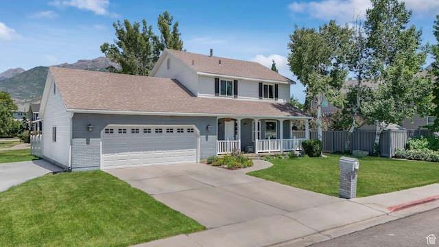 859 E 200 N, Orem, UT 84097 - traditional home featuring covered porch, an attached garage, brick siding, driveway, and a shingled roof