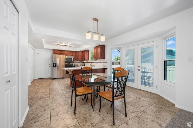 859 E 200 N, Orem, UT 84097 - dining area featuring a raised ceiling, french doors, healthy amount of natural light, and light tile patterned flooring