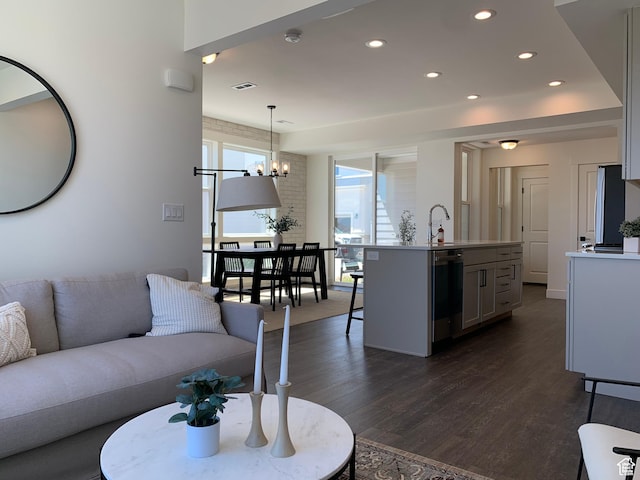 11556 S Watercourse Rd, South Jordan, UT 84009 - living area with dark wood-type flooring, a chandelier, and recessed lighting