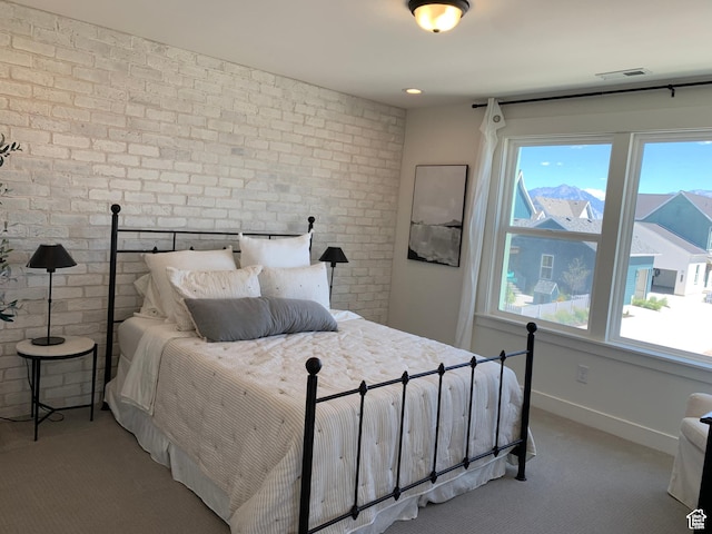 11556 S Watercourse Rd, South Jordan, UT 84009 - carpeted bedroom with brick wall and baseboards