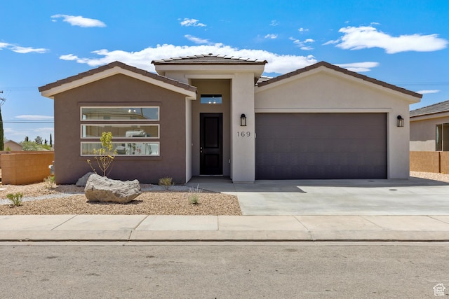 169 N 3670 W, Hurricane, UT 84737 - view of front of property with stucco siding, an attached garage, driveway, and a tile roof