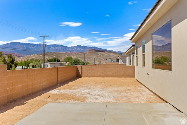 169 N 3670 W, Hurricane, UT 84737 - fenced backyard with a patio area and a mountain view