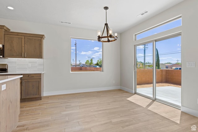 169 N 3670 W, Hurricane, UT 84737 - kitchen featuring a chandelier, light wood finished floors, light countertops, tasteful backsplash, and recessed lighting