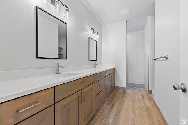 169 N 3670 W, Hurricane, UT 84737 - bathroom with double vanity, wood finished floors, and a tile shower