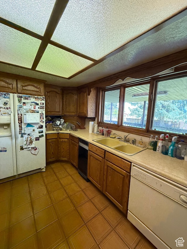263 E Fish Hatchery Rd, Mantua, UT 84324 - kitchen featuring white appliances, light countertops, brown cabinets, and a textured ceiling