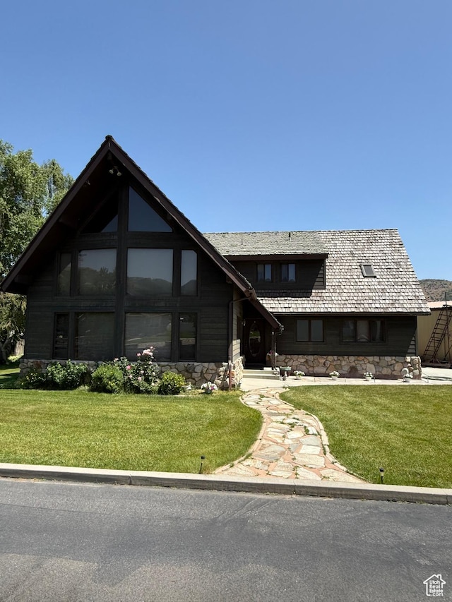 263 E Fish Hatchery Rd, Mantua, UT 84324 - view of front facade featuring stone siding and a front yard