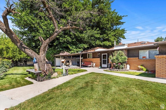 7459 W 3100 S, Magna, UT 84044 - view of front facade featuring brick siding and a patio