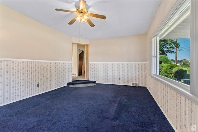 7459 W 3100 S, Magna, UT 84044 - carpeted spare room featuring wallpapered walls, wainscoting, and a ceiling fan