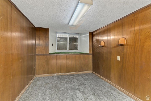 7459 W 3100 S, Magna, UT 84044 - unfurnished room with a textured ceiling, wood walls, and carpet flooring