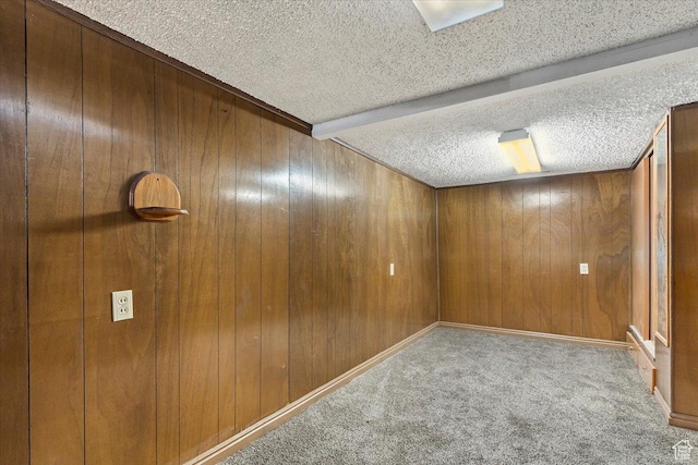7459 W 3100 S, Magna, UT 84044 - carpeted spare room with wood walls and a textured ceiling