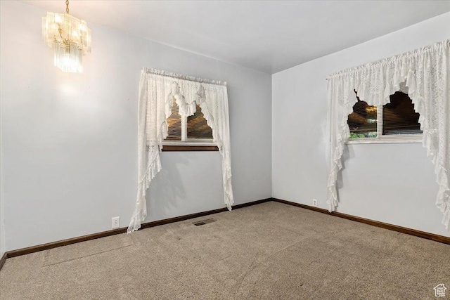 7459 W 3100 S, Magna, UT 84044 - carpeted empty room featuring a chandelier and baseboards