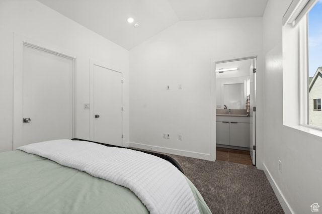 765 N 400 W Unit 205, Salt Lake City, UT 84103 - carpeted bedroom with lofted ceiling and ensuite bathroom