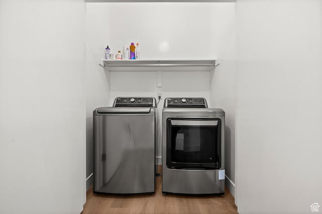 765 N 400 W Unit 205, Salt Lake City, UT 84103 - washroom with washing machine and dryer and wood finished floors