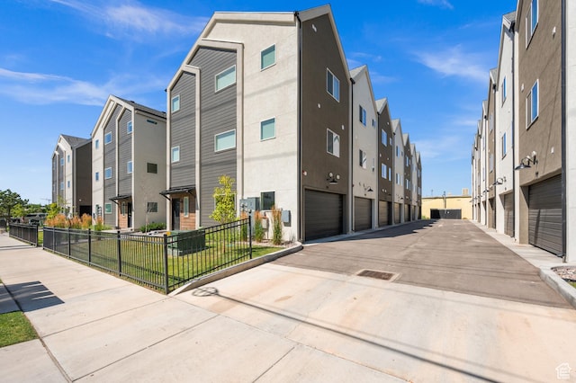 765 N 400 W Unit 205, Salt Lake City, UT 84103 - view of building exterior with driveway and an attached garage