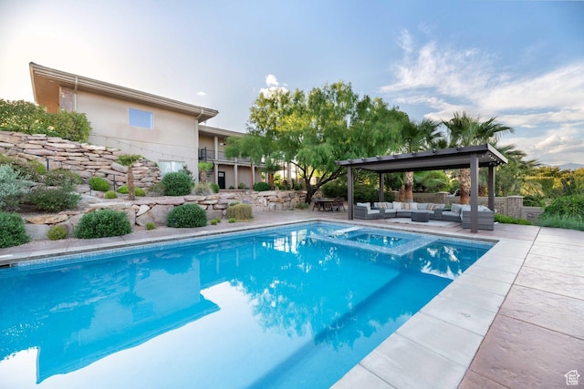 1557 S Stone Cliff Dr, St George, UT 84790 - view of swimming pool with an outdoor hangout area, a patio, and a pool with connected hot tub