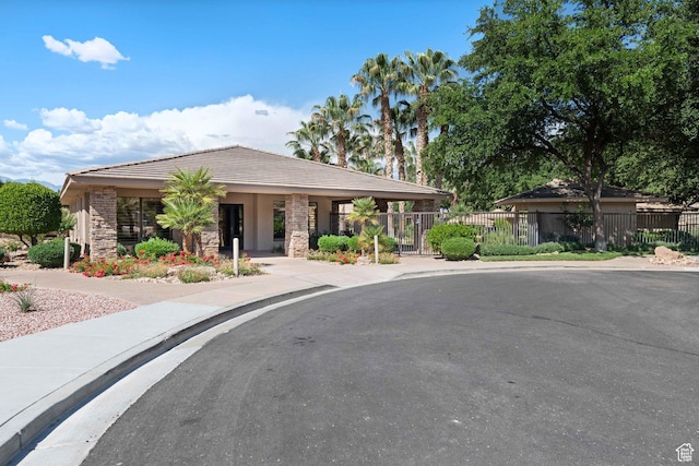 1557 S Stone Cliff Dr, St George, UT 84790 - view of front of home featuring stone siding and a tile roof