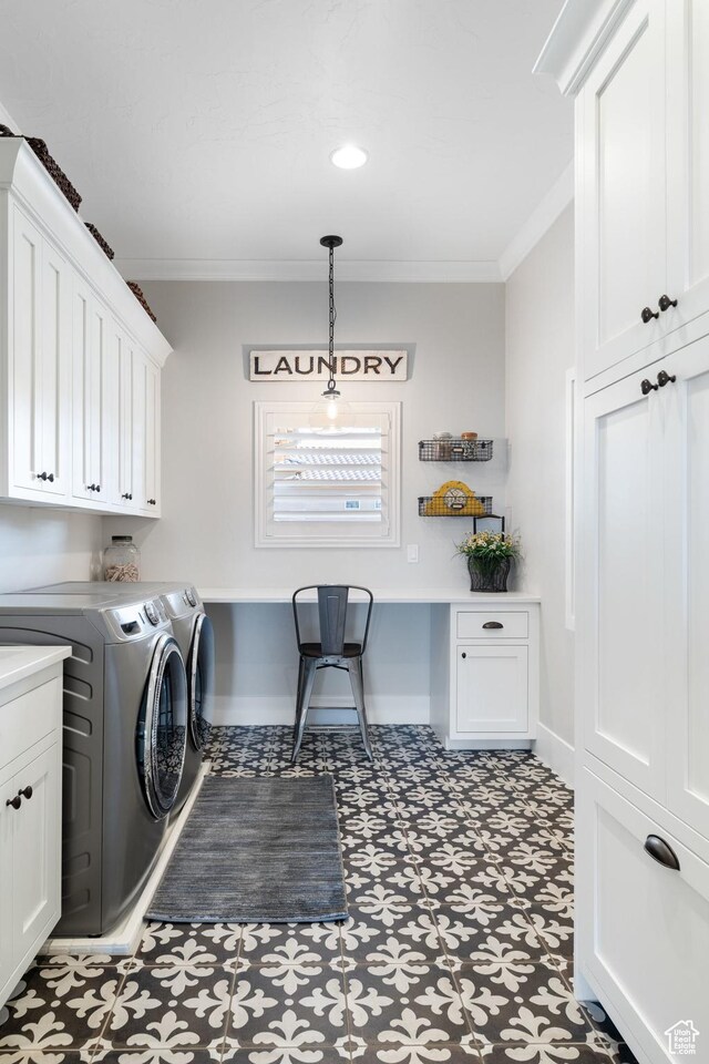 1557 S Stone Cliff Dr, St George, UT 84790 - washroom with washing machine and dryer, cabinet space, ornamental molding, and tile patterned floors