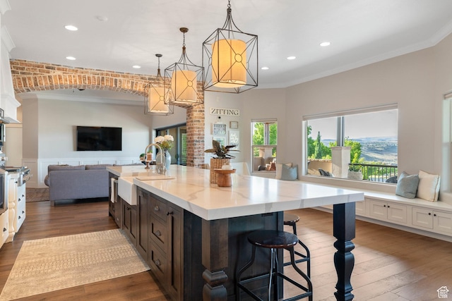 1557 S Stone Cliff Dr, St George, UT 84790 - kitchen with ornamental molding, open floor plan, recessed lighting, dark wood finished floors, and pendant lighting