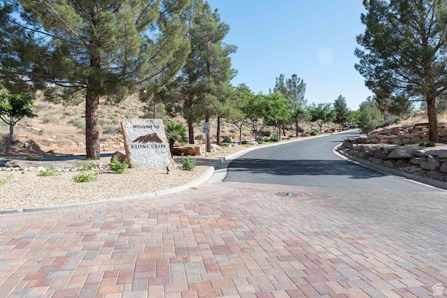 1557 S Stone Cliff Dr, St George, UT 84790 - view of asphalt road with curbs