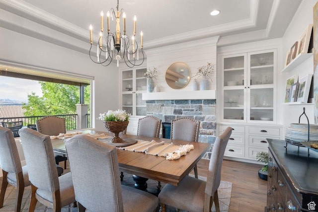 1557 S Stone Cliff Dr, St George, UT 84790 - dining space featuring a chandelier, dark wood-style floors, a tray ceiling, crown molding, and recessed lighting