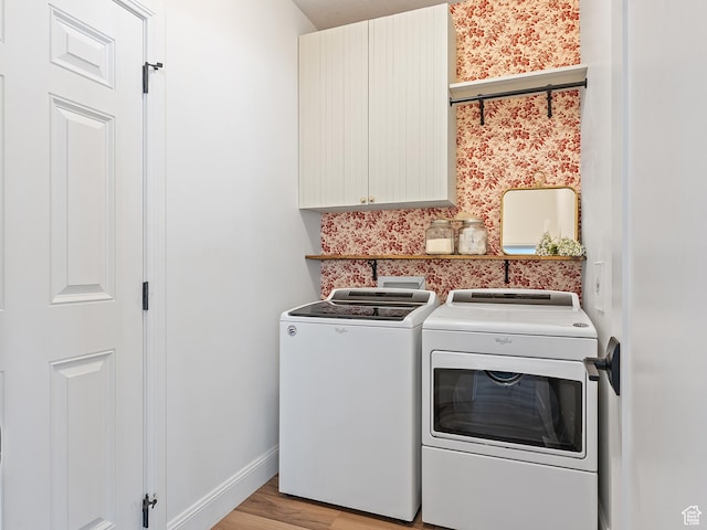 2148 E 970 N, Spanish Fork, UT 84660 - laundry area featuring cabinet space, washer and clothes dryer, light wood finished floors, and wallpapered walls