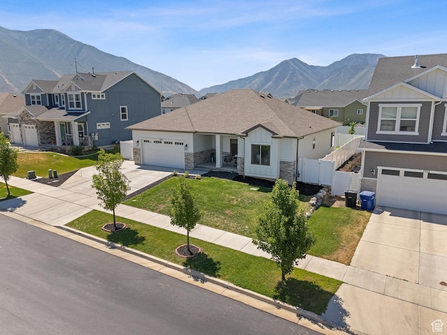 2148 E 970 N, Spanish Fork, UT 84660 - view of front of home featuring driveway, board and batten siding, stone siding, and a mountain view