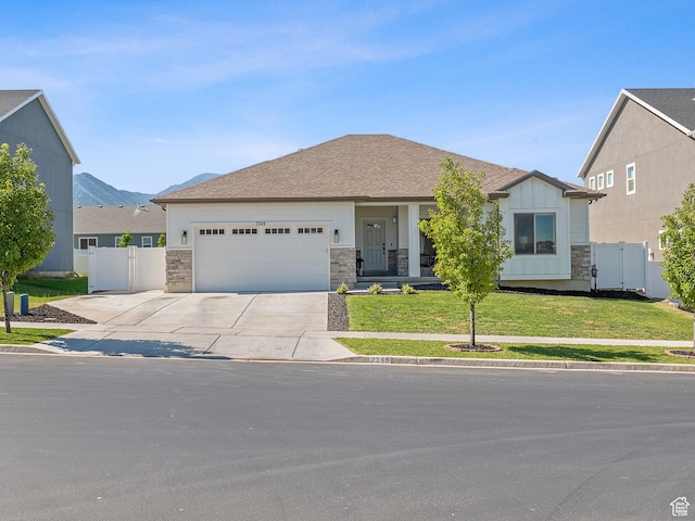 2148 E 970 N, Spanish Fork, UT 84660 - ranch-style home featuring an attached garage, concrete driveway, stone siding, and board and batten siding