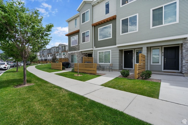 655 W 1430 S, Orem, UT 84058 - view of front of property featuring a front yard, stone siding, and a residential view