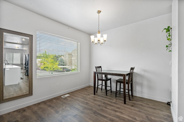 655 W 1430 S, Orem, UT 84058 - dining area with a chandelier and dark wood-style flooring