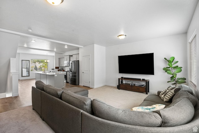 655 W 1430 S, Orem, UT 84058 - carpeted living area featuring baseboards and wood finished floors