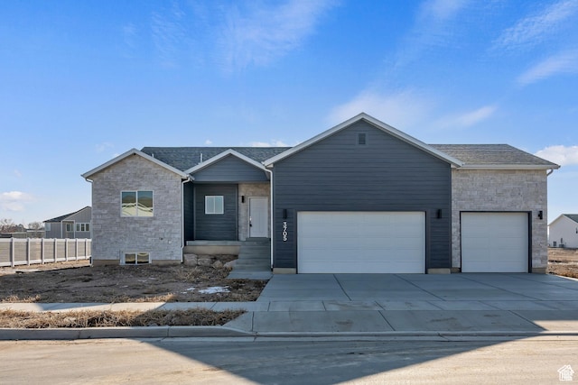 3705 W Chalgrove Rd, Taylor, UT 84401 - single story home with stone siding, concrete driveway, and an attached garage