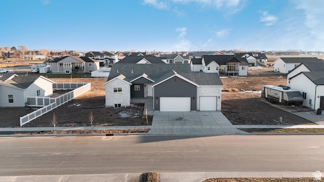 3705 W Chalgrove Rd, Taylor, UT 84401 - view of front of house featuring a residential view, concrete driveway, and an attached garage