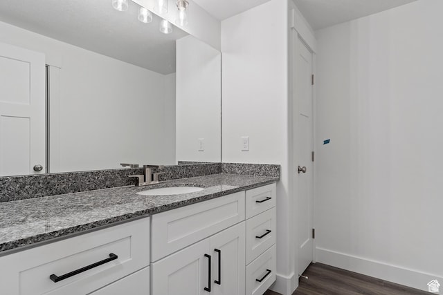 3705 W Chalgrove Rd, Taylor, UT 84401 - bathroom featuring wood finished floors and vanity