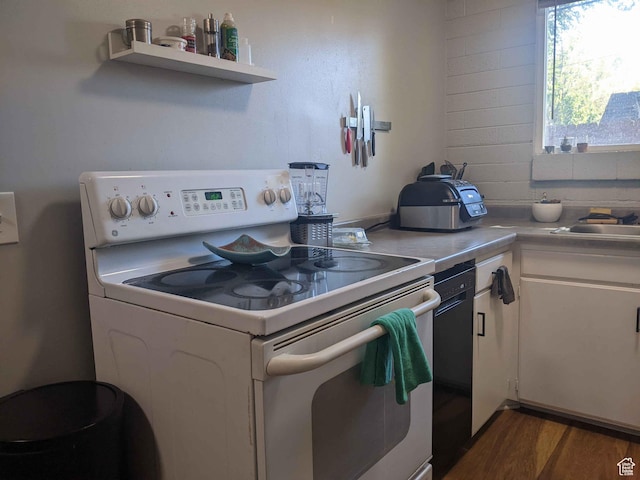 173 N K St E, Salt Lake City, UT 84103 - kitchen featuring white electric stove, white cabinetry, dark wood finished floors, dishwasher, and light countertops