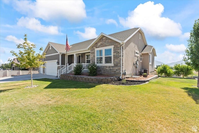 1608 S Terrace Rd, Saratoga Springs, UT 84045 - ranch-style home with stone siding, an attached garage, driveway, a porch, and a front yard