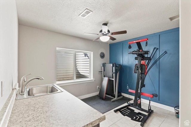 1608 S Terrace Rd, Saratoga Springs, UT 84045 - exercise area featuring ceiling fan, a textured ceiling, and tile patterned floors