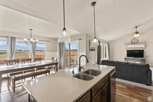 1608 S Terrace Rd, Saratoga Springs, UT 84045 - kitchen with dark wood finished floors, a chandelier, a textured ceiling, pendant lighting, and open floor plan
