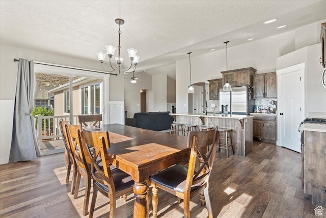 1608 S Terrace Rd, Saratoga Springs, UT 84045 - dining space featuring dark wood-style flooring, a chandelier, and a textured ceiling