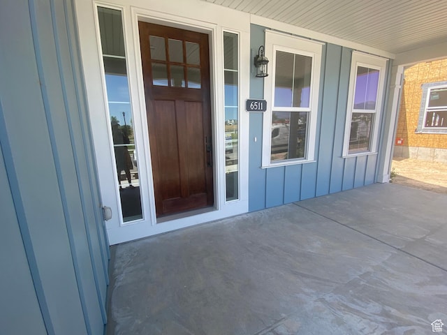 6511 W Lake Ave, South Jordan, UT 84009 - doorway to property with board and batten siding and covered porch