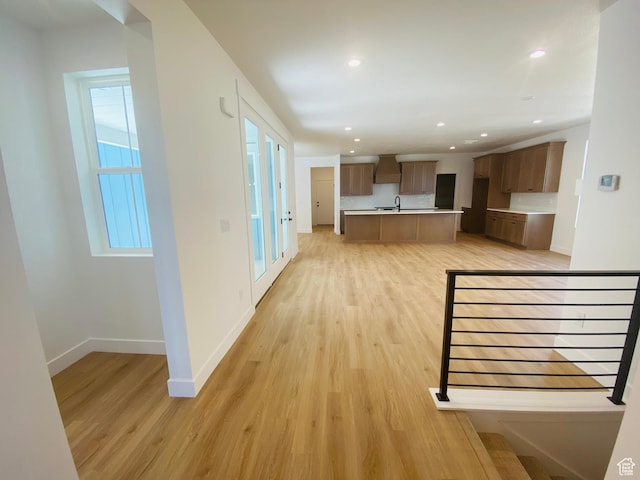 6511 W Lake Ave, South Jordan, UT 84009 - unfurnished living room with light wood-style floors and recessed lighting