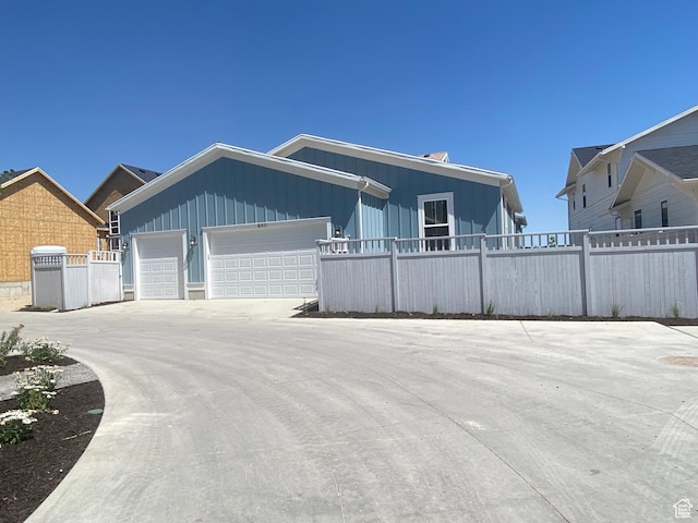 6511 W Lake Ave, South Jordan, UT 84009 - view of front of property with board and batten siding and an attached garage