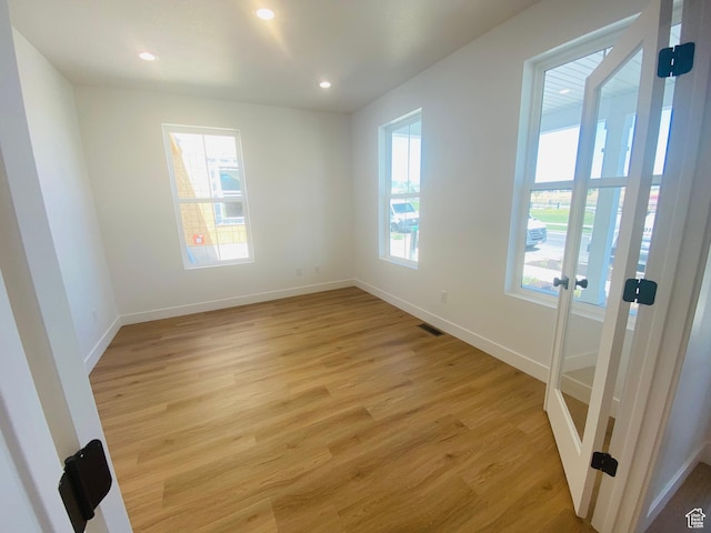 6511 W Lake Ave, South Jordan, UT 84009 - empty room featuring light wood finished floors and recessed lighting