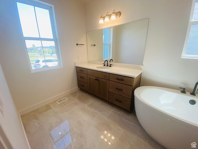 6511 W Lake Ave, South Jordan, UT 84009 - full bathroom with a soaking tub and vanity